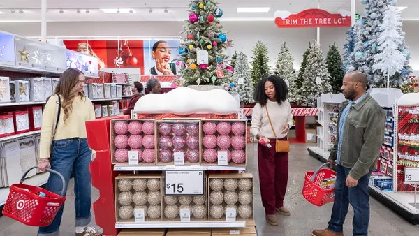 Three customers shop at a Target store.