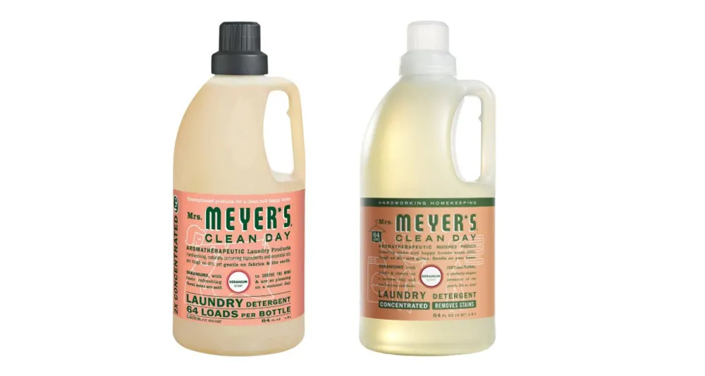 Two bottles of Mrs. Meyer&#x27;s cleaning products, one with a black plastic cap and the other with a white plastic cap.