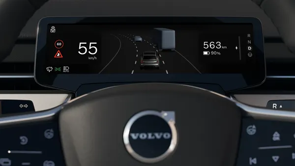 The instrument cluster of a Volvo electric vehicles showing the screen and a speed of 55 km/h.