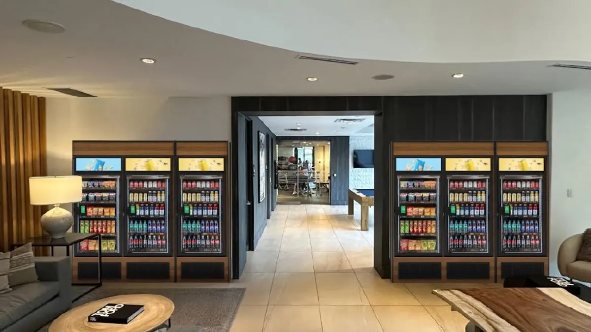 A photo of several coolers in the common area of a multi-unit housing area.