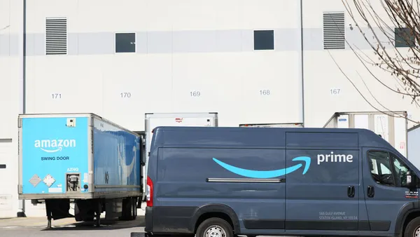 An Amazon delivery truck drives past Amazon's JFK8 Staten Island fulfillment center in Staten Island on March 25, 2022 in New York City.