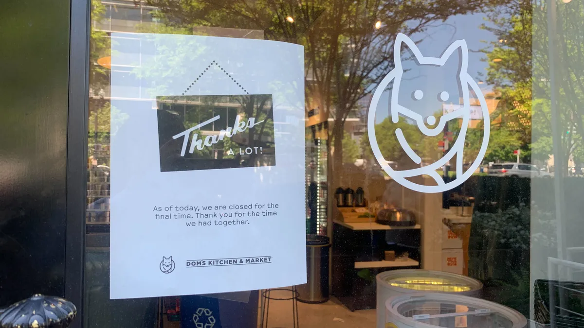 A photo of a sign in the window of a Foxtrot site. It says "Thanks a lot! As of today, we are closing for the final time. Thank you for the time we had together."