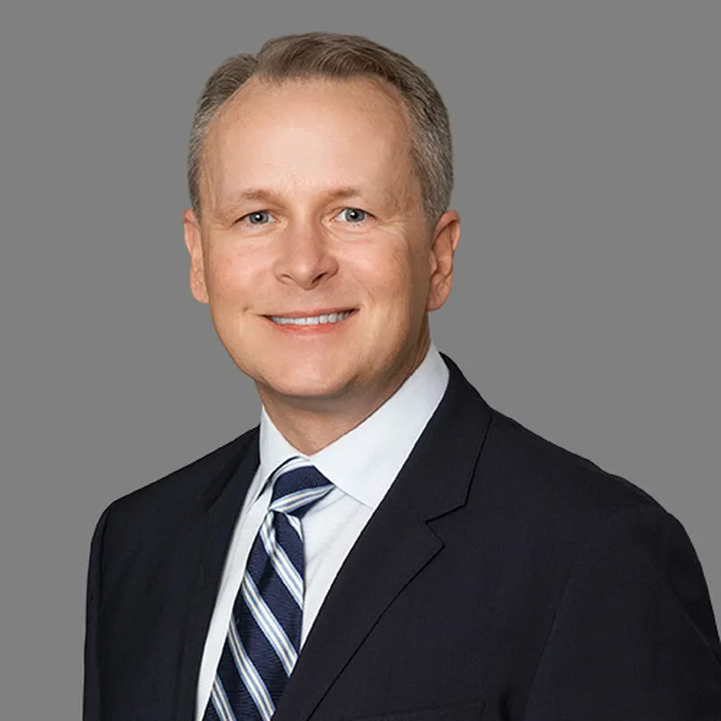 A professional headshot.