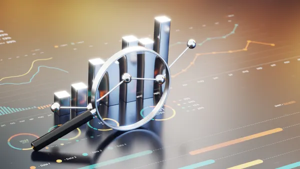 Business Growth Analysis With Magnifying Glass Over Bar Chart