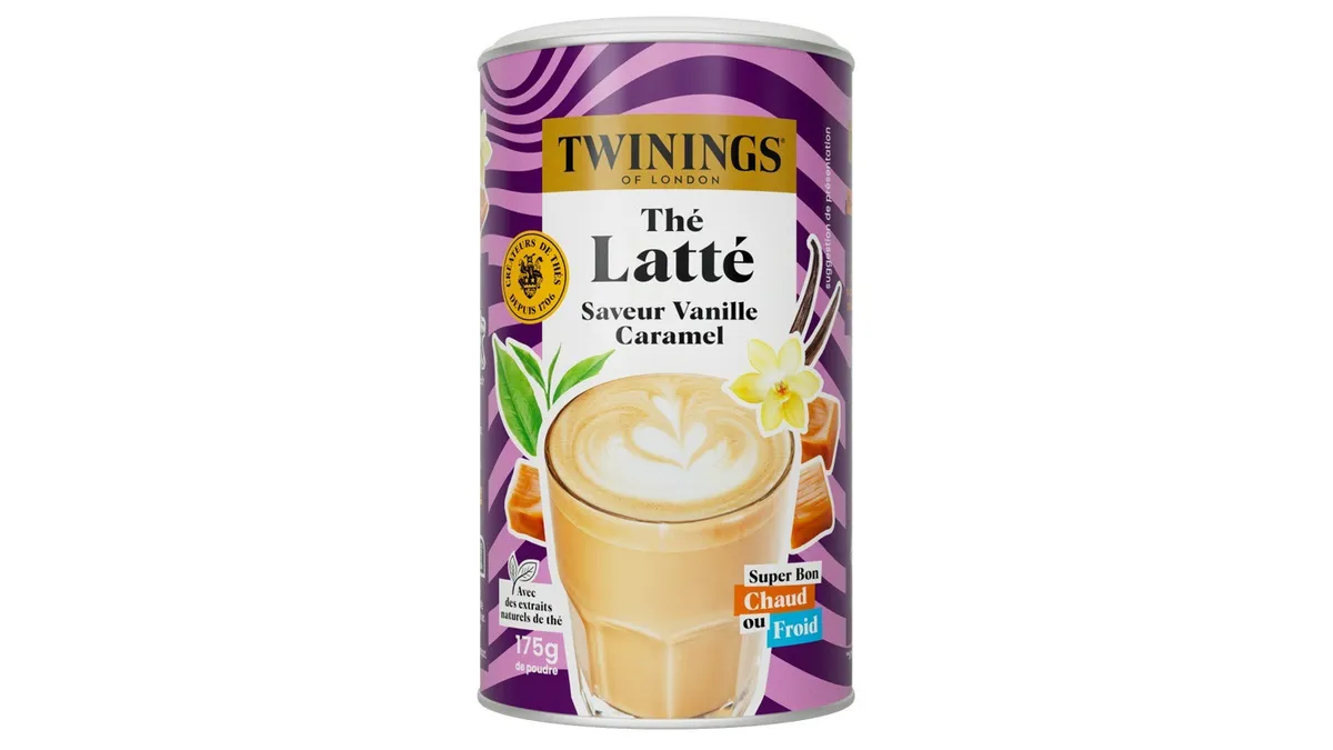 A close-up view of Twinings Thé Latté powdered beverage in a fiber-based, cylindrical container.