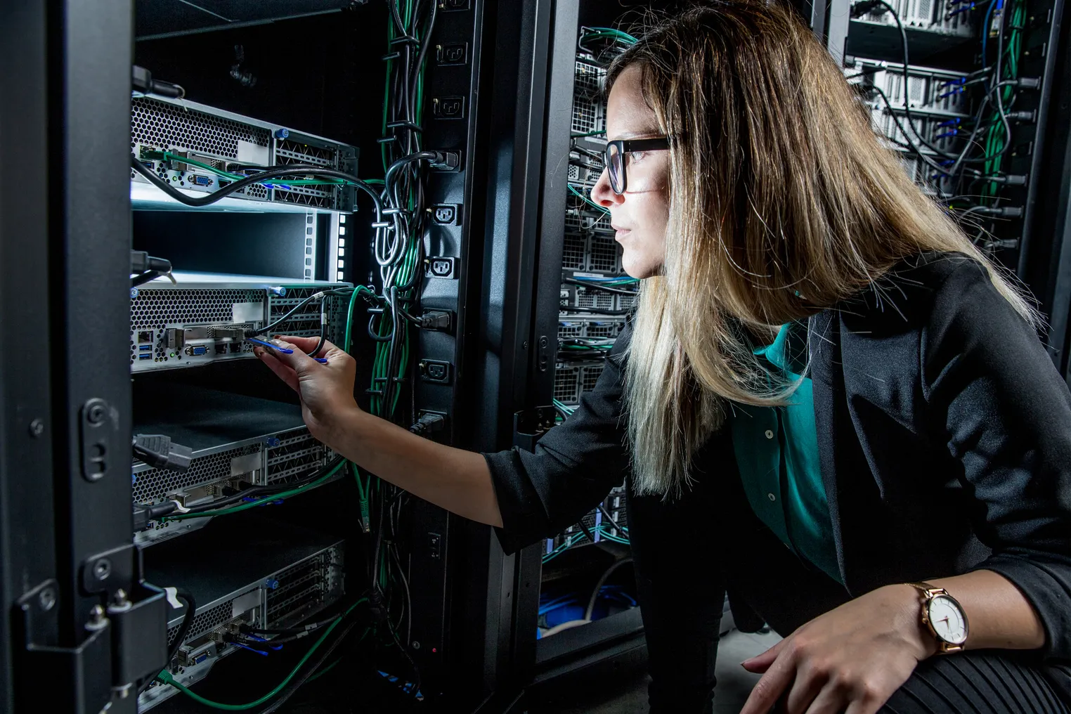 Female IT Engineer Working in Server Room. HCLTech, PrimaryIO