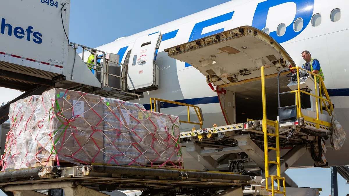 Air cargo gets loaded onto a United Airlines 777 aircraft to support Hawaii wildfire disaster relief