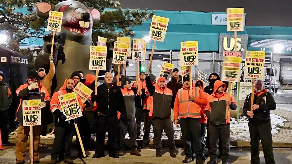 Union workers picket during a strike outside a US Foods facility in the Chicago area.