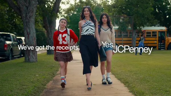A woman and two girls walk back to school in a JCPenney ad
