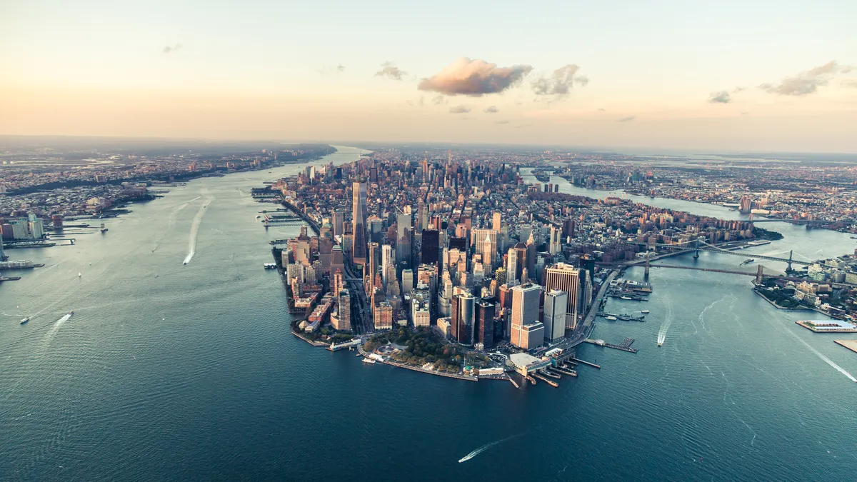 Manhattan skyline at sunset from an elevated angle.