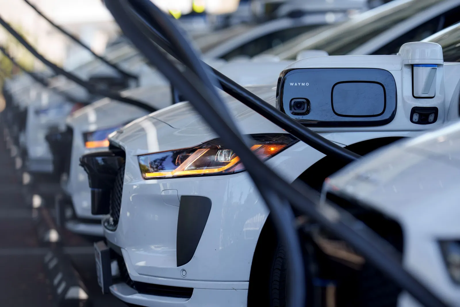 Electric vehicles charge at a charging station.