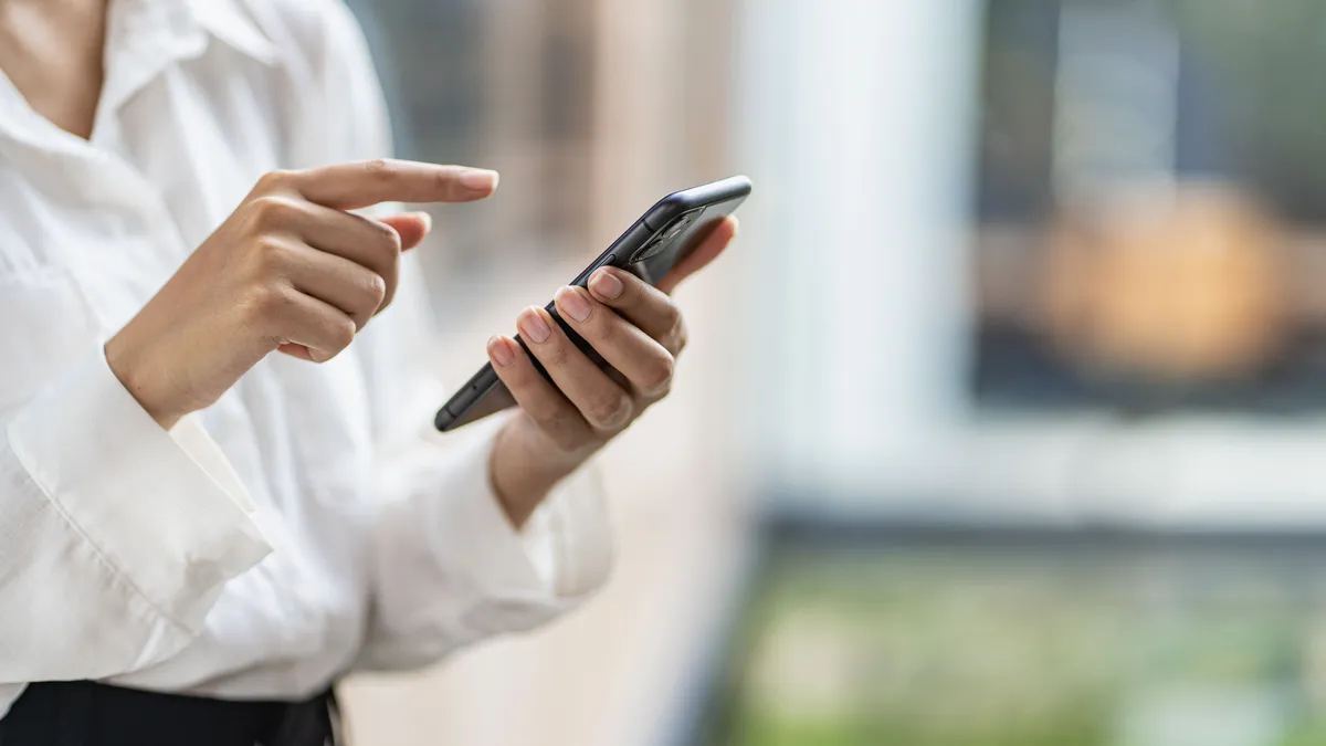 Person uses mobile phone to make payment