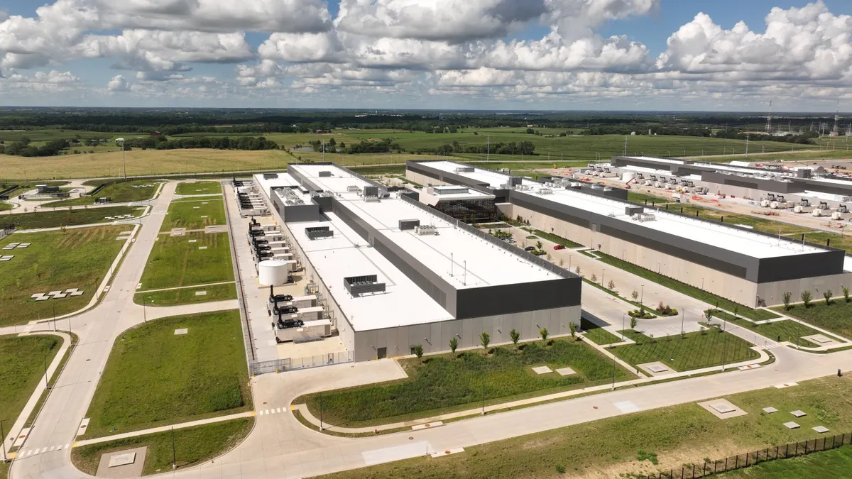 An aerial view of a large warehouse-like building.