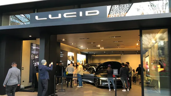Shoppers at Lucid Motors Showroom at Westfield University Towne Centre (UTC) shopping mall.