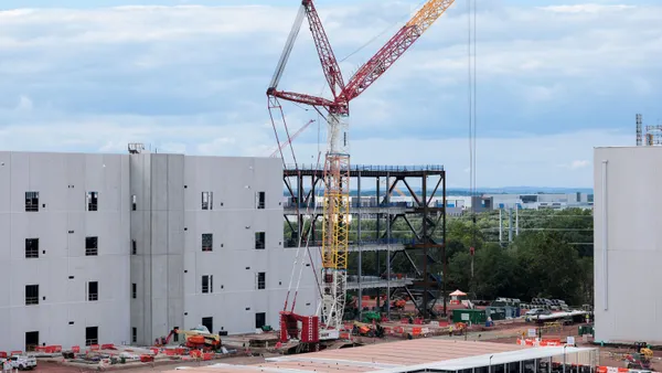 A crane sits at an industrial construction site.