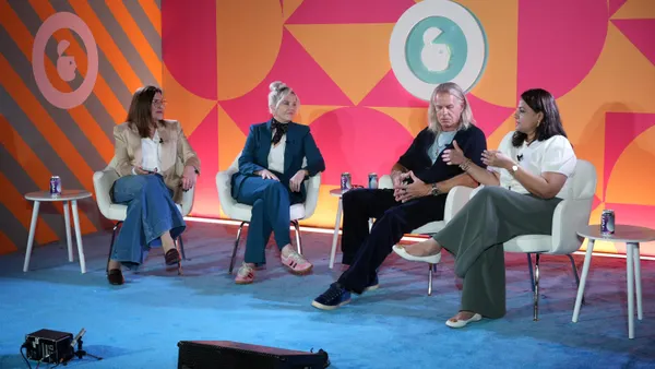 Four executives sit on a stage at the Advertising Week New York conference in October, 2026.