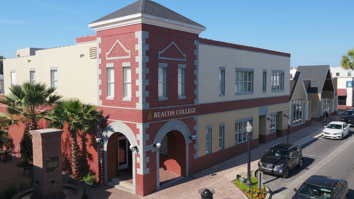 A birdseye view of a corner building that reads "Beacon College"