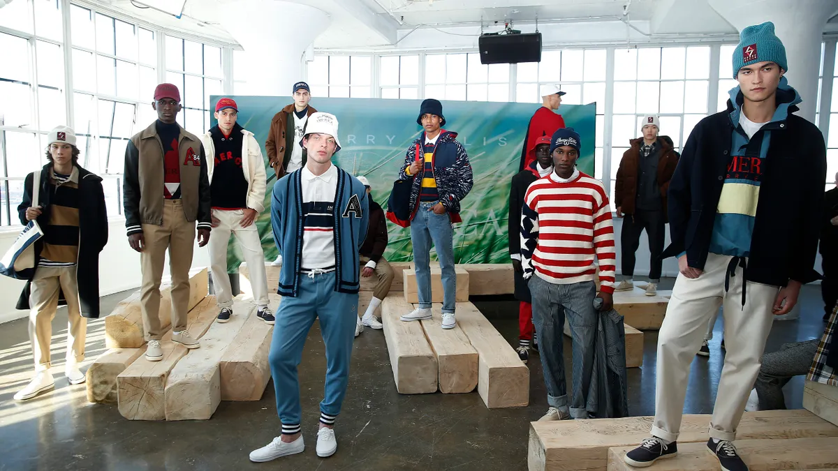 Ten models wearing various pieces of Perry Ellis clothing are seen posing during New York Fashion Week.