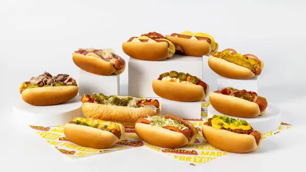 A photo of several hot dogs against a white background.