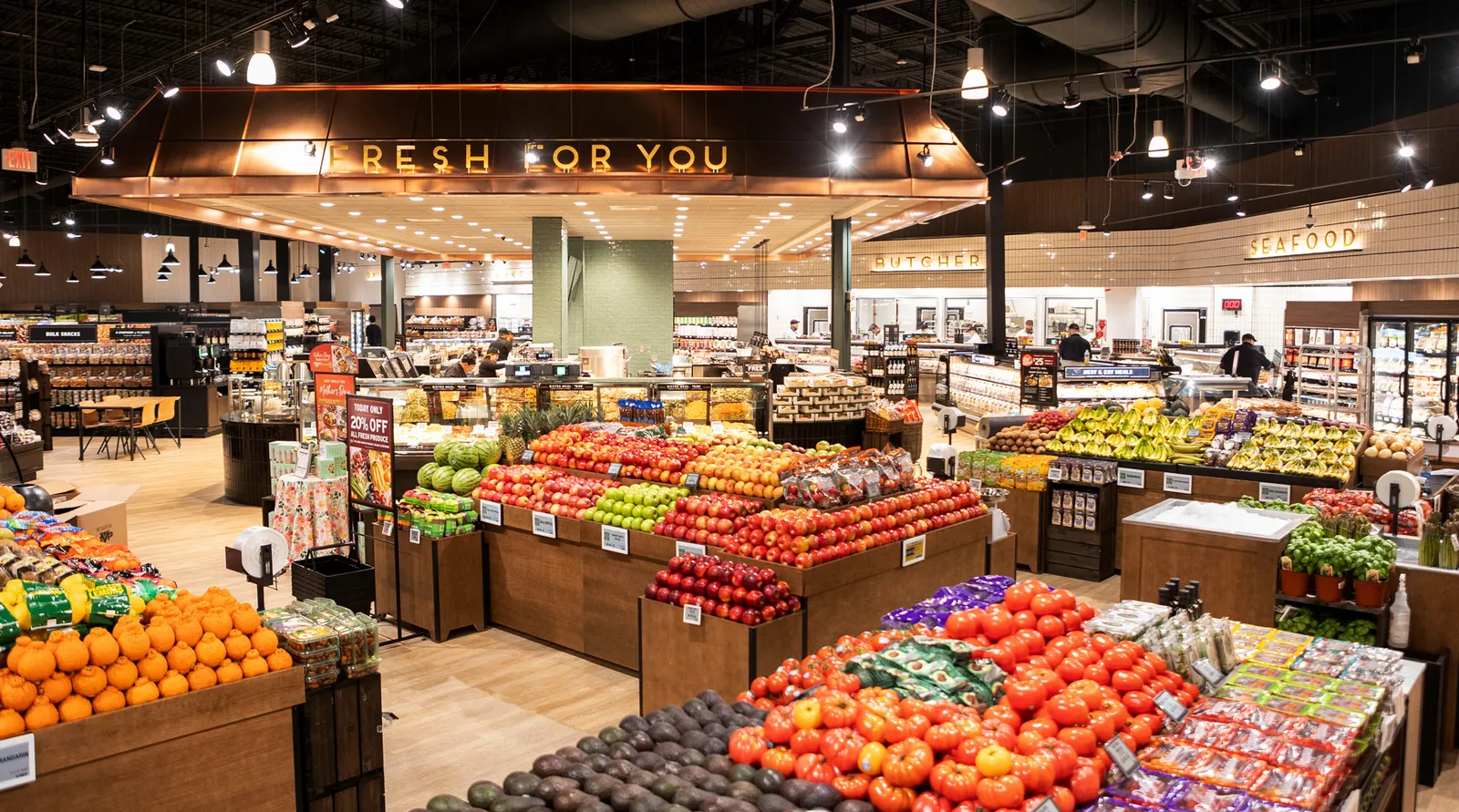 View of The Fresh Market&#x27;s center store area, including produce area and Fresh For You department