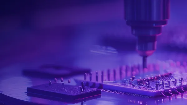 Manufacturing machinery with a purple overlay.