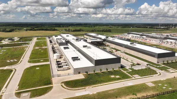 An aerial view of a large warehouse-like building.