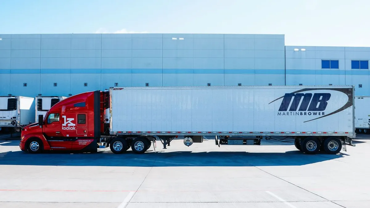 A Kodiak truck and Martin Brower trailer outside a facility.