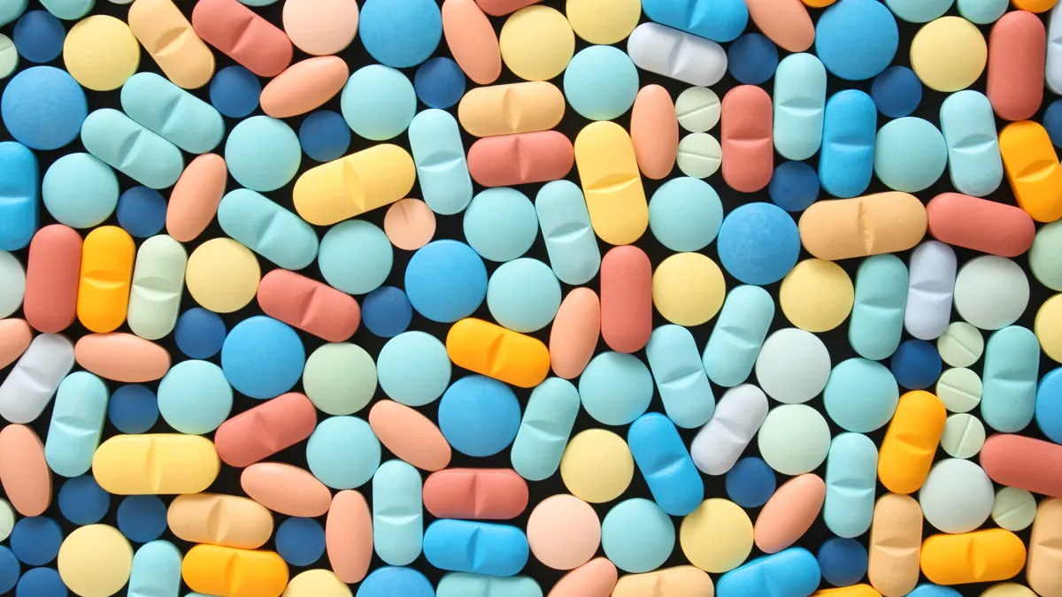 An array of multi-colored pills are shown together in this stock image.