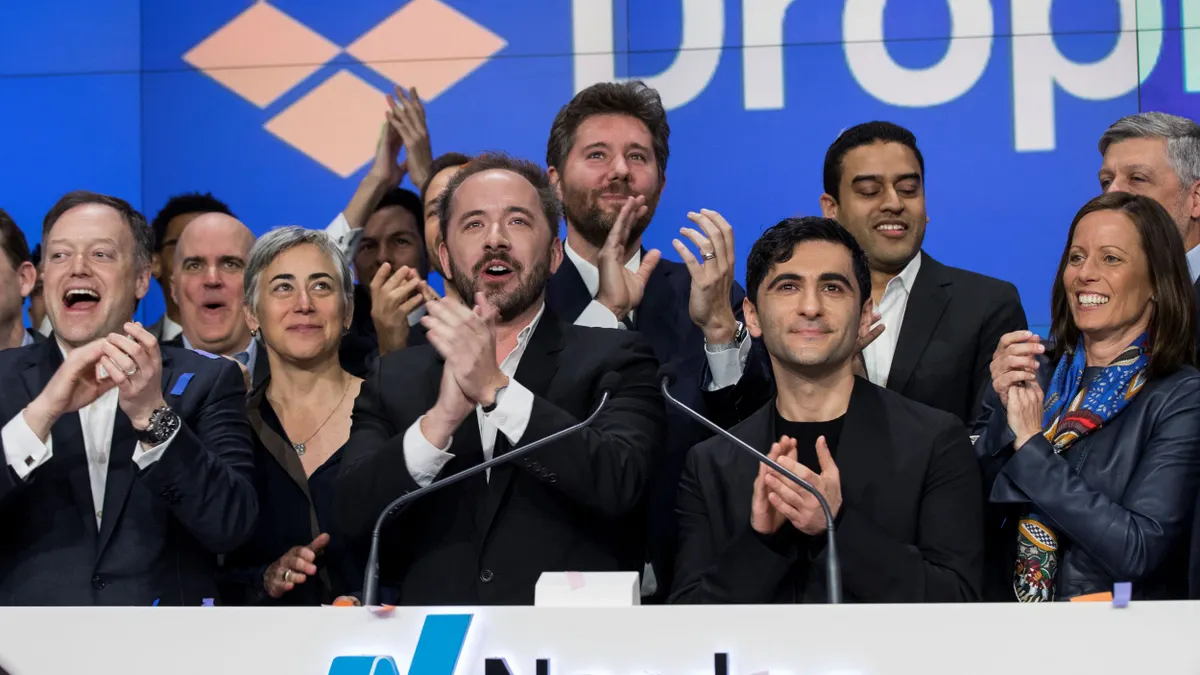 Dropbox executives celebrate the launch of Dropbox's initial public offering.