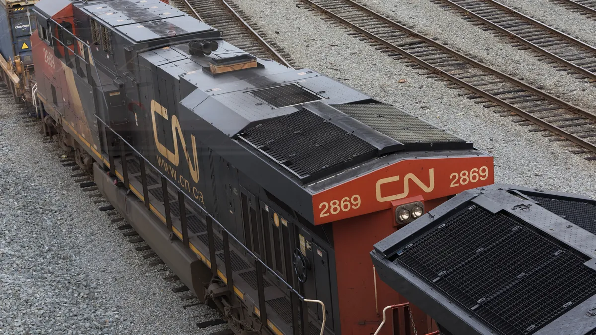 A Canadian National Railway locomotive pulls a train on a track