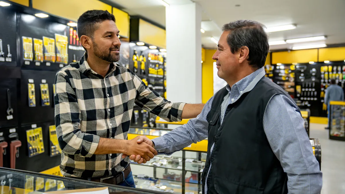 A store associate helps a customer in a hardware store