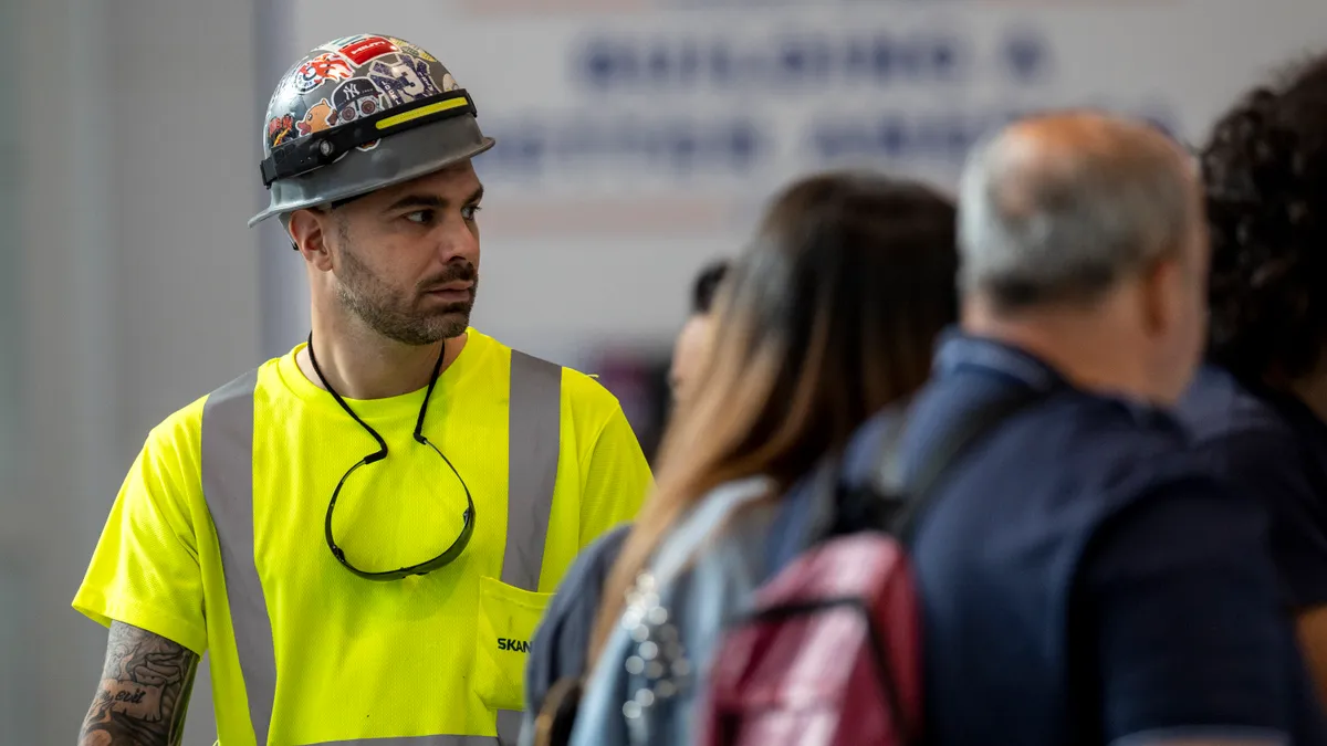 A construction worker walks through the Stamford Transportation Center on August 28, 2023 in Stamford, Connecticut.