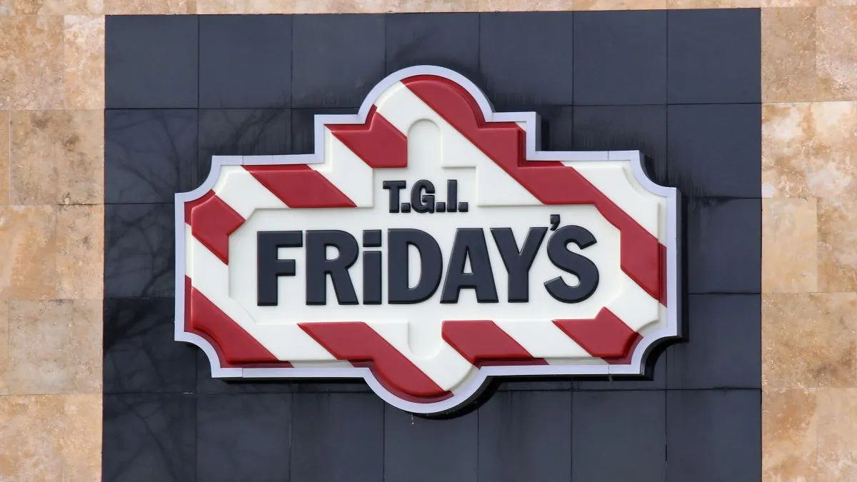 An image of TGI Fridays signage with red and white stripes