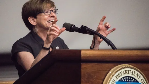 Former EEOC Commissioner Chai Feldblum speaks at podium