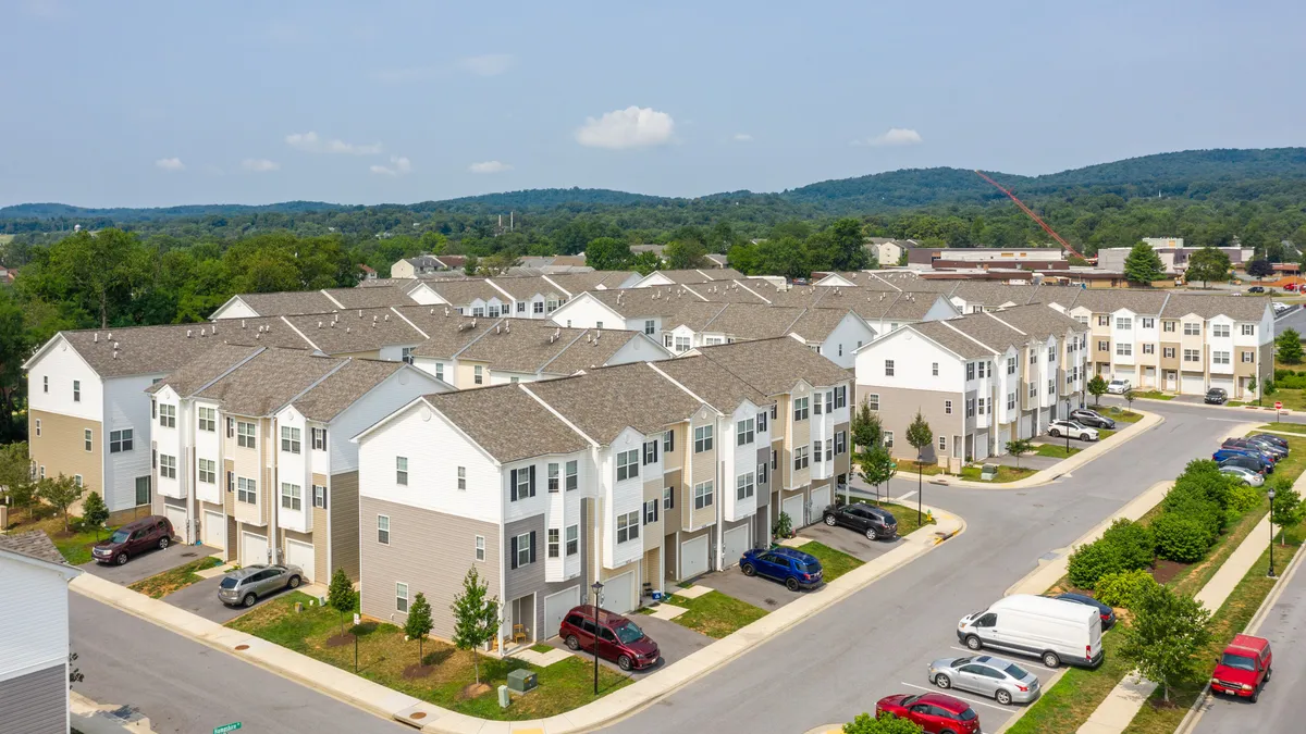 Aerial view of three-story apartment complex.