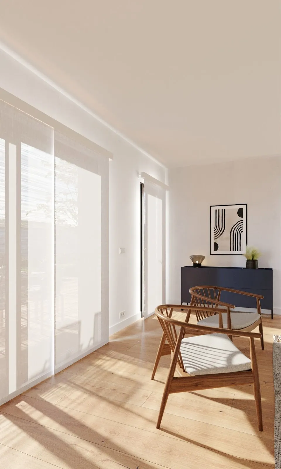 A room with chairs, as well as a semi-sheer white window shade.