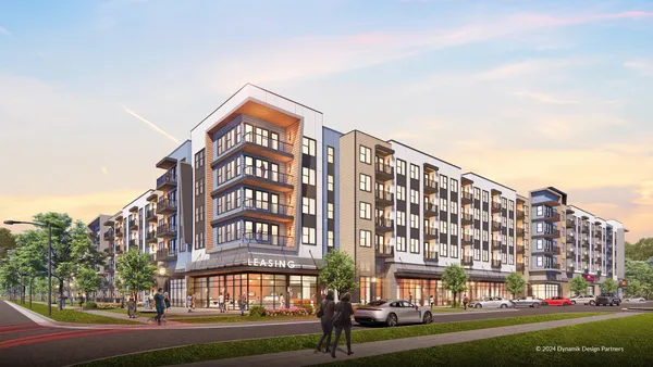 New mid-rise multifamily project next to a street.