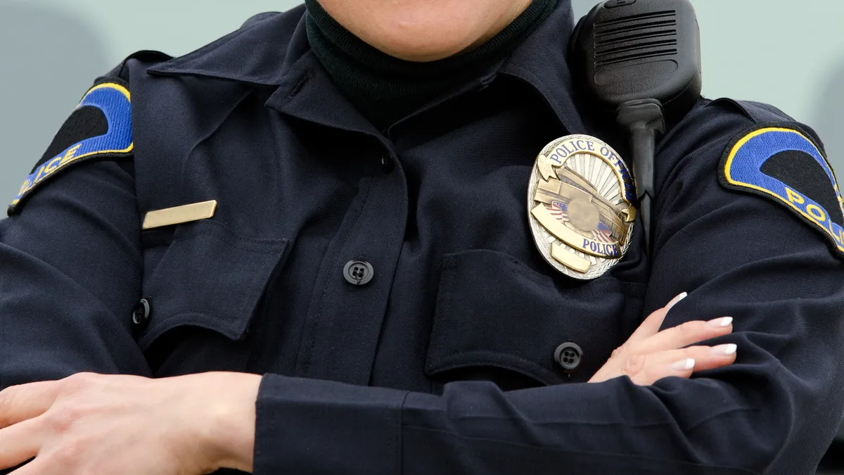 A smiling police officer