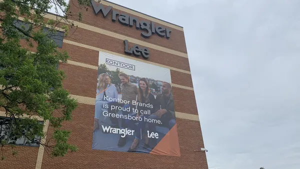 A closeup of the Kontoor Brands headquarters, showcasing the signs for Lee and Wrangler.