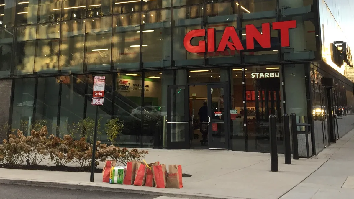 Exterior of grocery story with sign