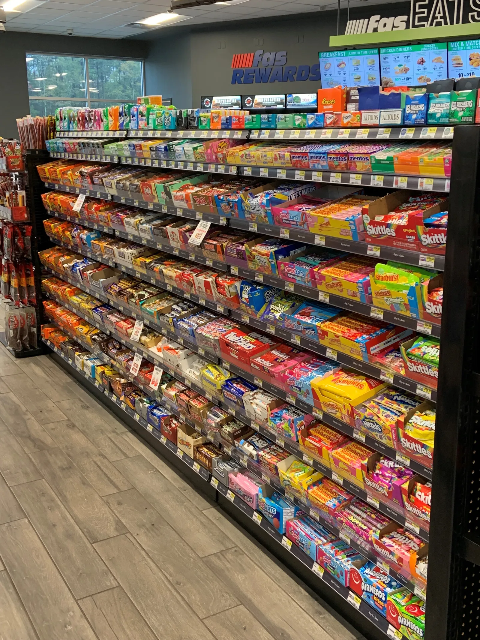 A photo of the candy aisle inside a Fas Mart.