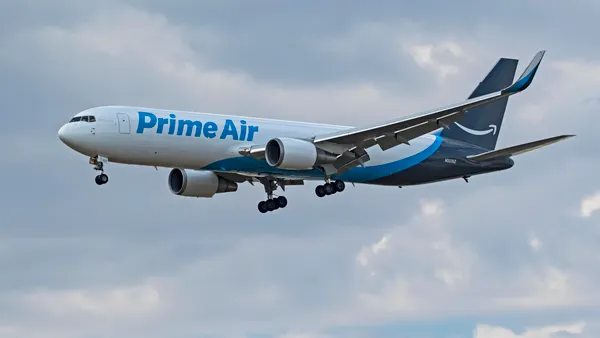An Amazon Prime Air cargo jet in the air.