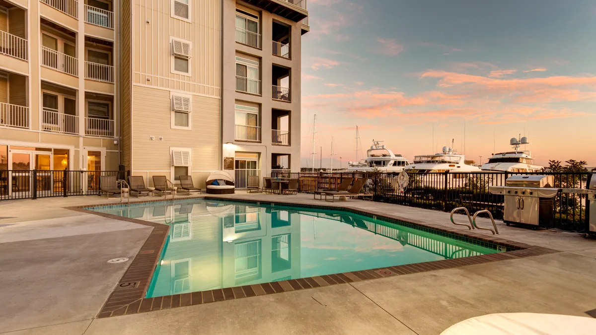 Apartments with pool in the foreground.