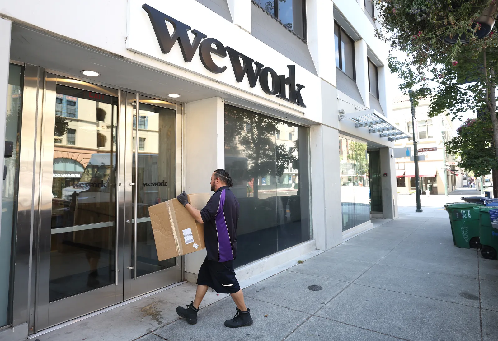 A FedEx driver makes a delivery to a WeWork office on August 09, 2023 in Berkeley, California.