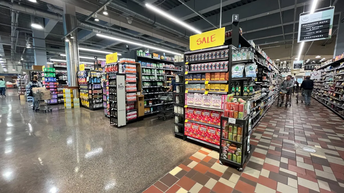 Inside a Whole Foods Market store in Washington, D.C., with end caps signifying a sale.