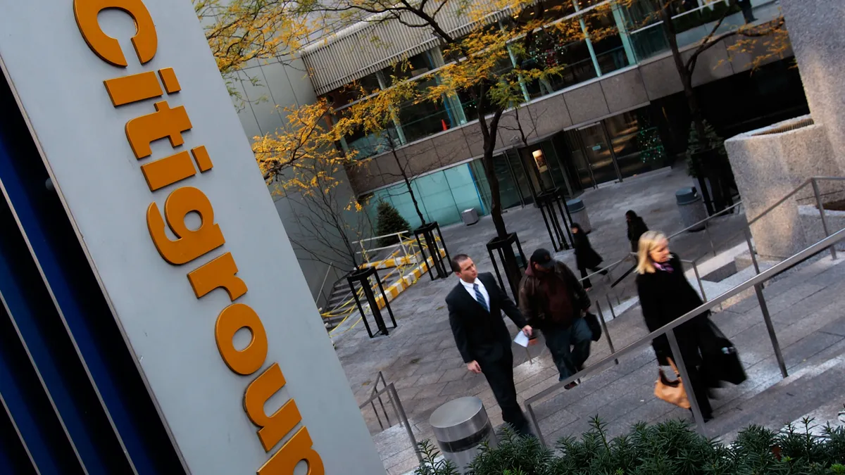 People walk up from the plaza at the Citigroup Center November 17, 2008 in New York City.