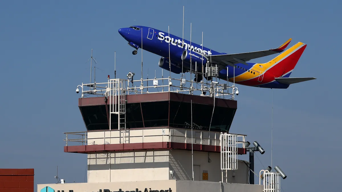 A Southwest Airlines take off past the control tower at Burbank Hollywood Airport on September 25, 2023 in Burbank, California.