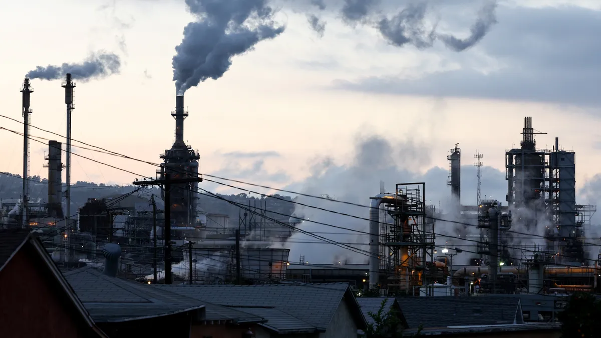 The Phillips 66 Los Angeles Refinery Wilmington Plant stands beyond a residential street on November 28, 2022 in Wilmington, California.