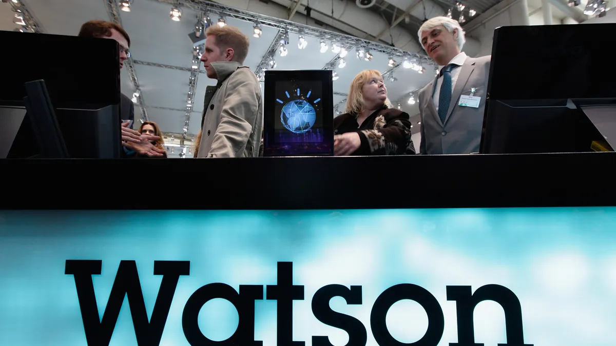 Visitors check out a slimmed down version of the IBM Watson supercomputer recently featured on the Jeopardy television game show at the IBM stand at the CeBIT technology trade fair on March 2, 2011 in