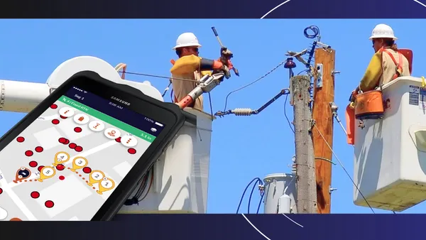 Workers fixing an electric pole